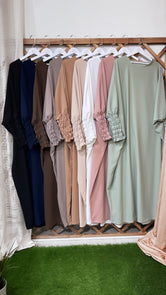 Hijab Paradise, grucce, vestiti, colorate, nero, blu, marrone, beaje scuro, caramello, beaje, bianco, rosa, verde acqua, maniche a frisè, vestito lungo, abaya, vestito largo, da preghiera